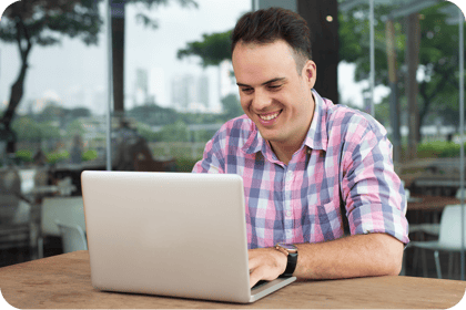 happy-optimistic-freelancer-working-with-laptop-outdoor-cafe 1 happy-optimistic-freelancer-working-with-laptop-outdoor-cafe 1
